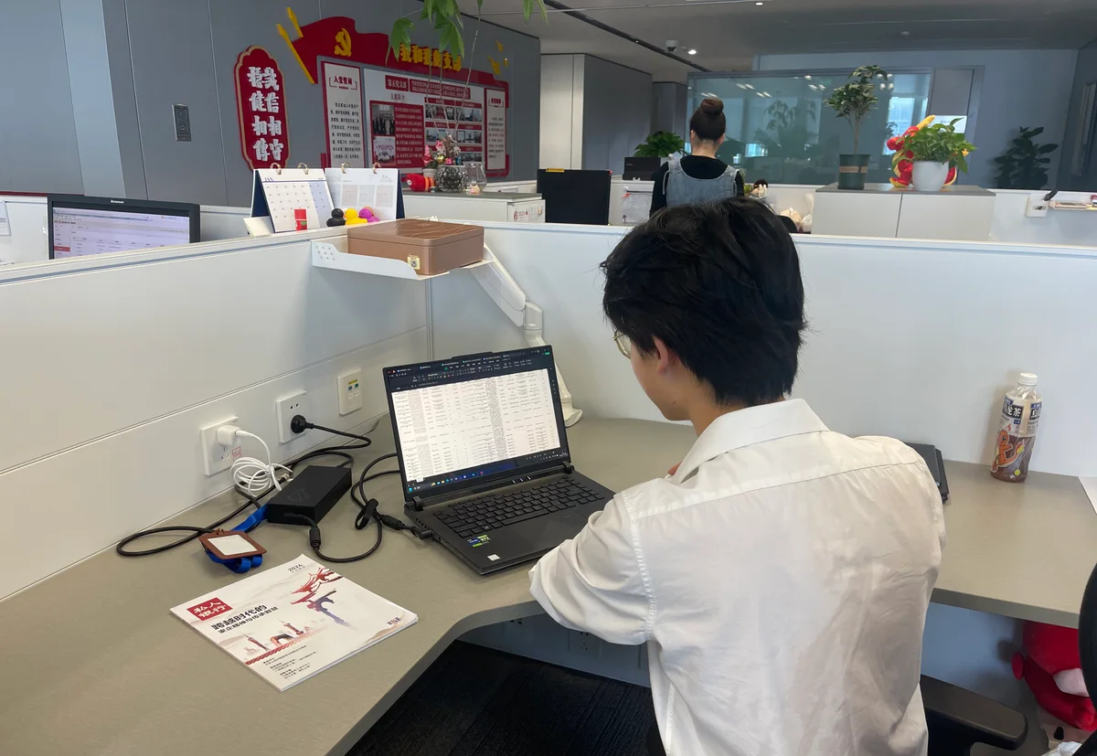 Charles working at a laptop during his ICBC internship